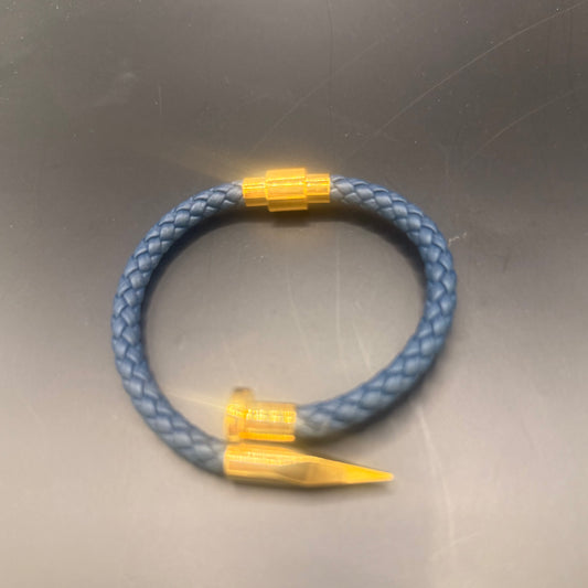 “Le Clou” royal blue braided leather bracelet, stainless steel gold plated.